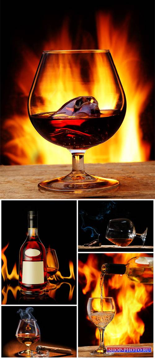 Cognac, bottle and glasses of cognac - Stock Photo