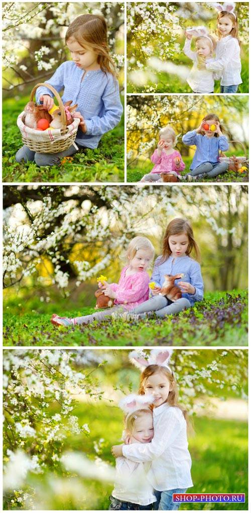 Children in the spring garden, Easter - stock photos
