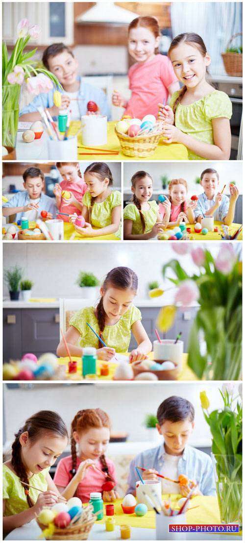 Children paint easter eggs - stock photos