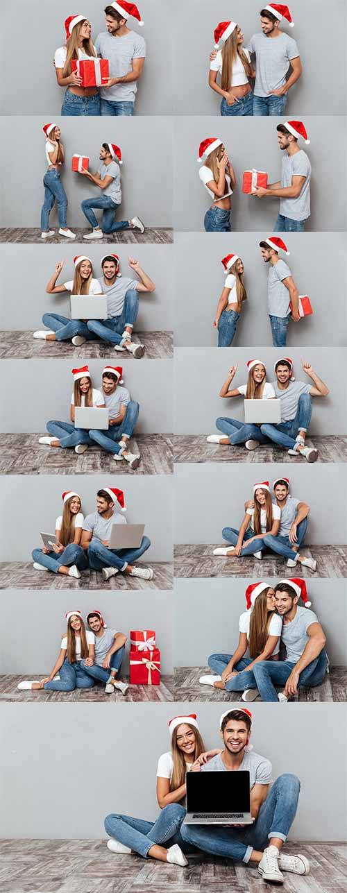 Парень и девушка в новогодних колпаках - Фотоклипарт